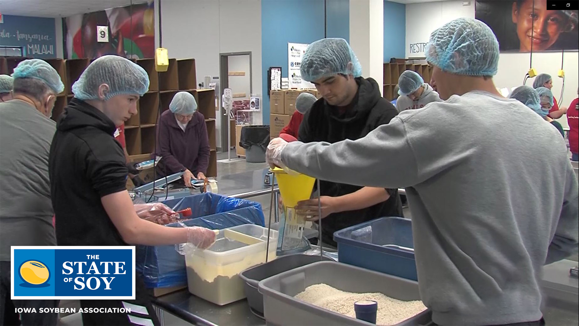 Volunteers packaging food for starving children