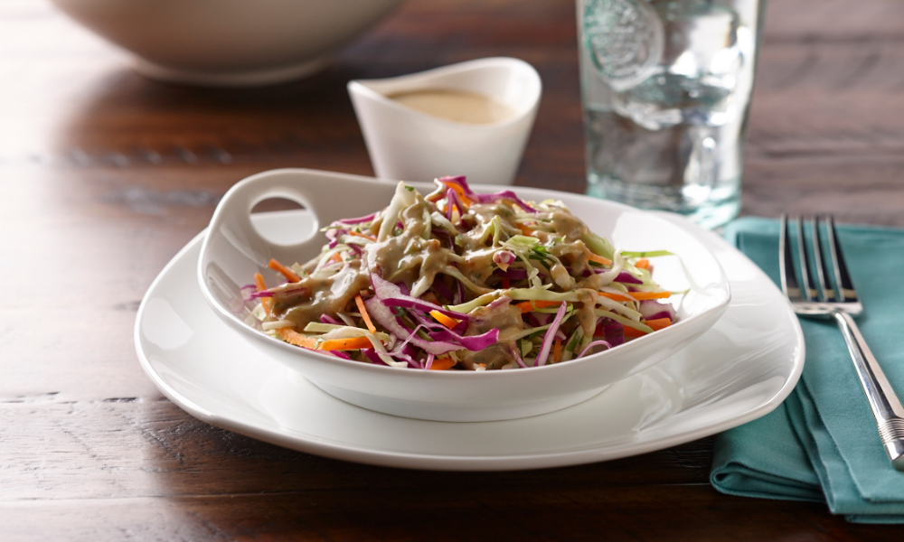 Spicy toasted sesame tofu dressing on a slaw salad.