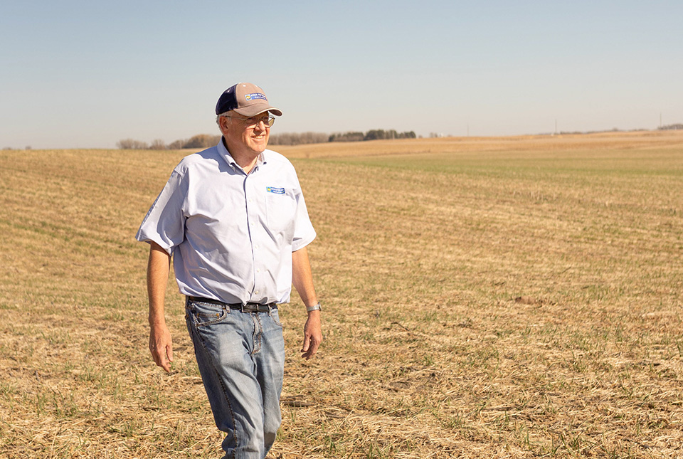 Iowa farmer standing in farm field