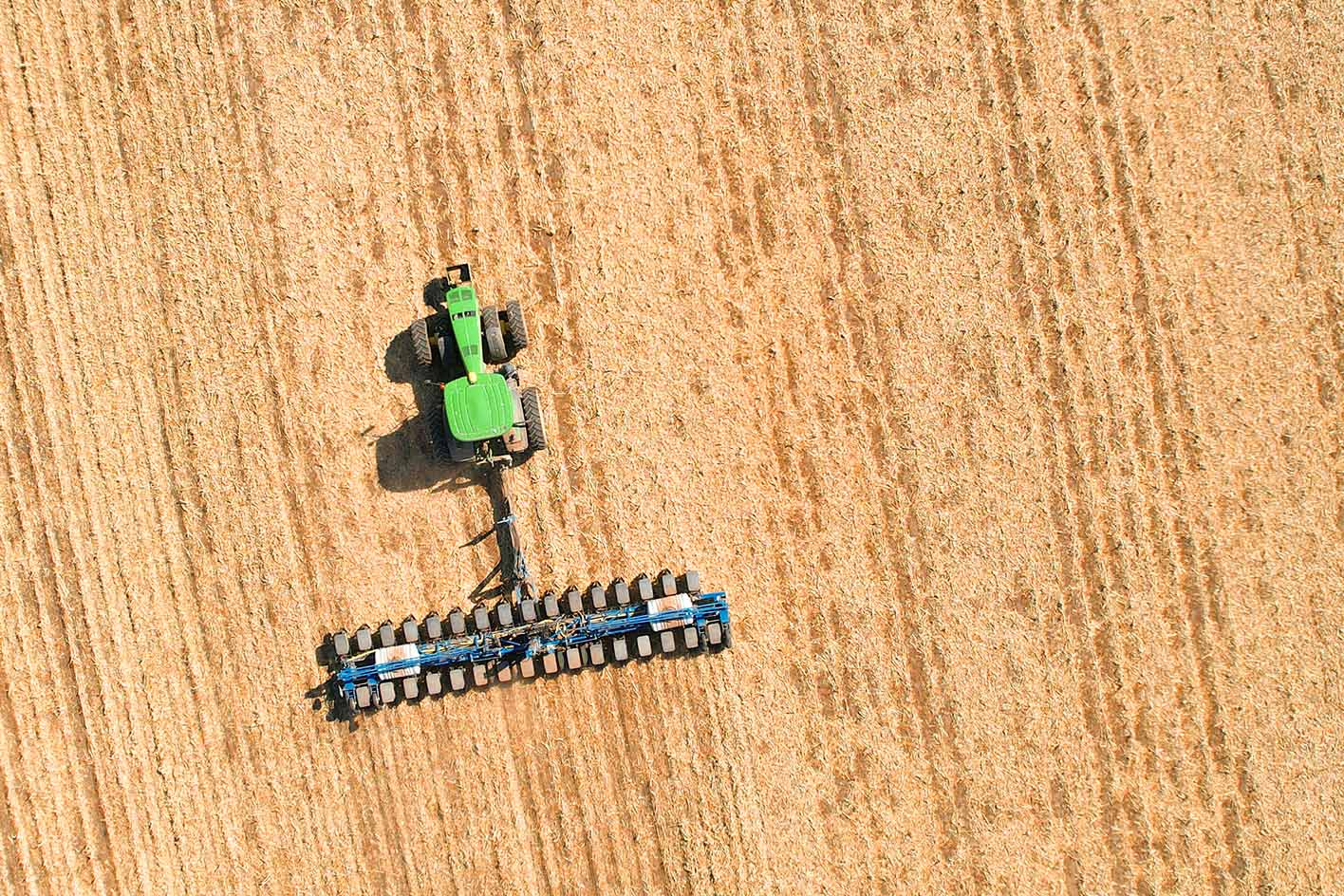 John Deere tractor planting soybeans in Iowa