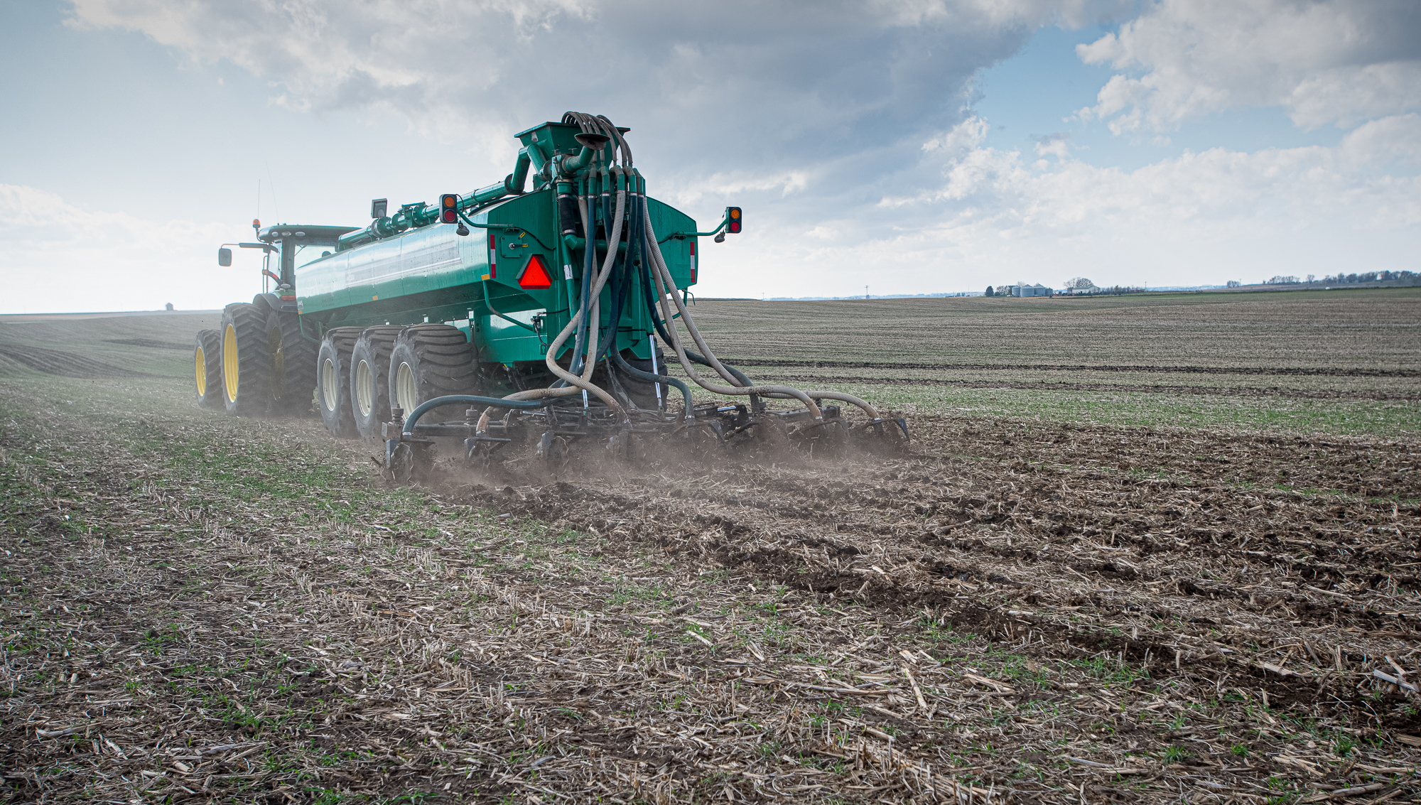 A manure injector in a field