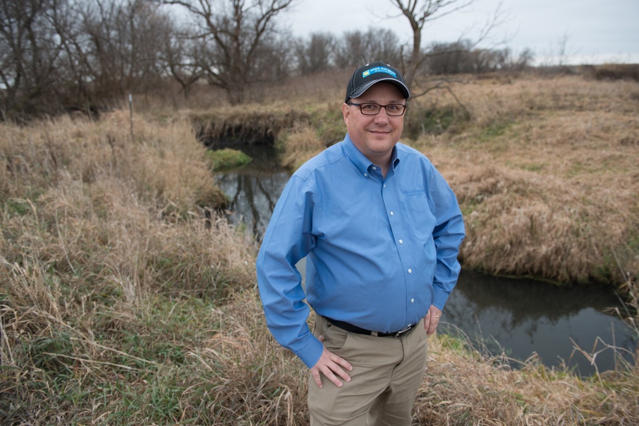 Chris Hay, Iowa Soybean Association, stands in a bigger