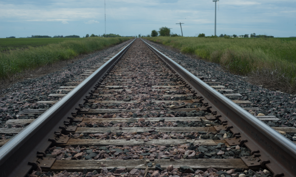 Railroad tracks cut through the countryside