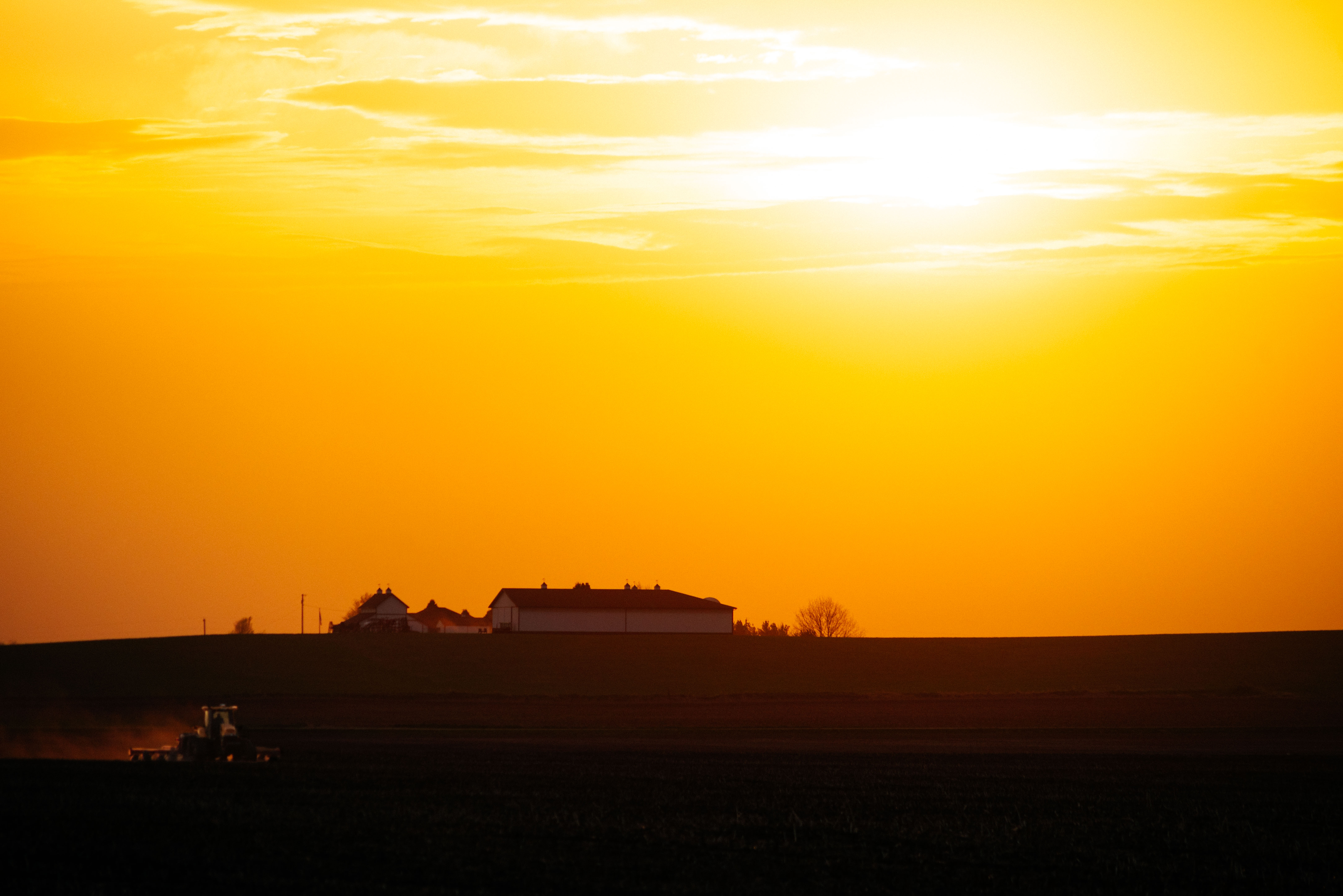 A tractor plants in a field north of Marshalltown, Iowa