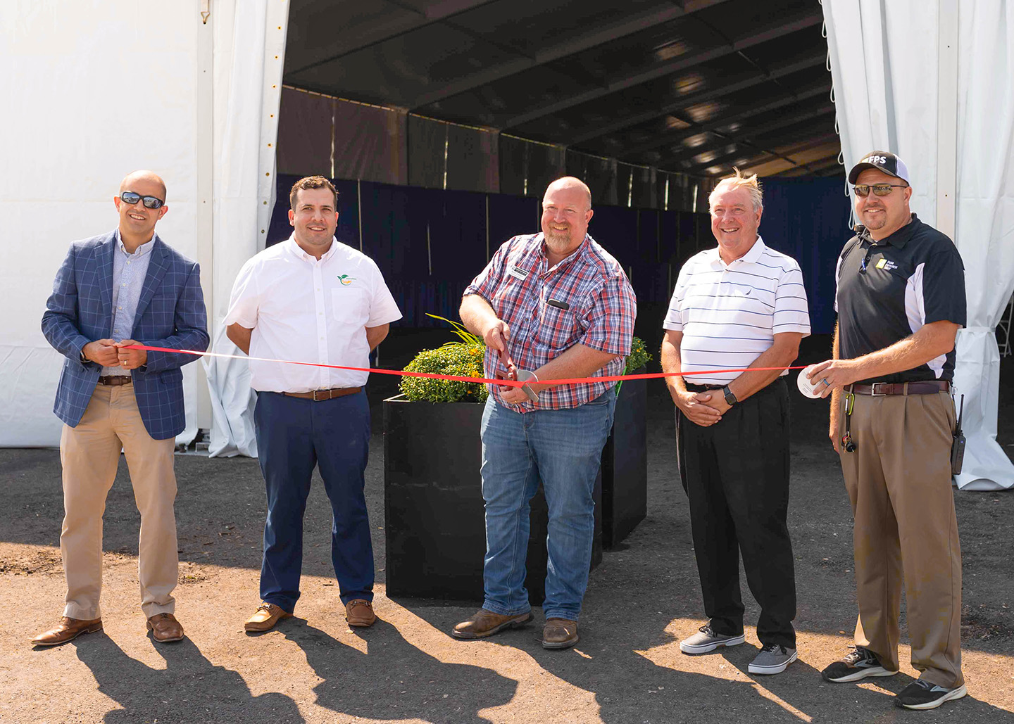 Cutting the ribbon during the opening of the FPS