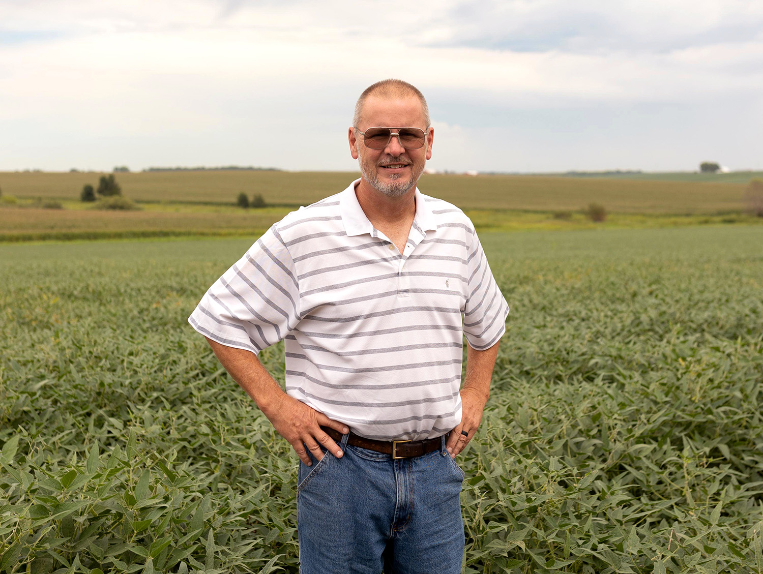 Iowa soybean grower standing in field