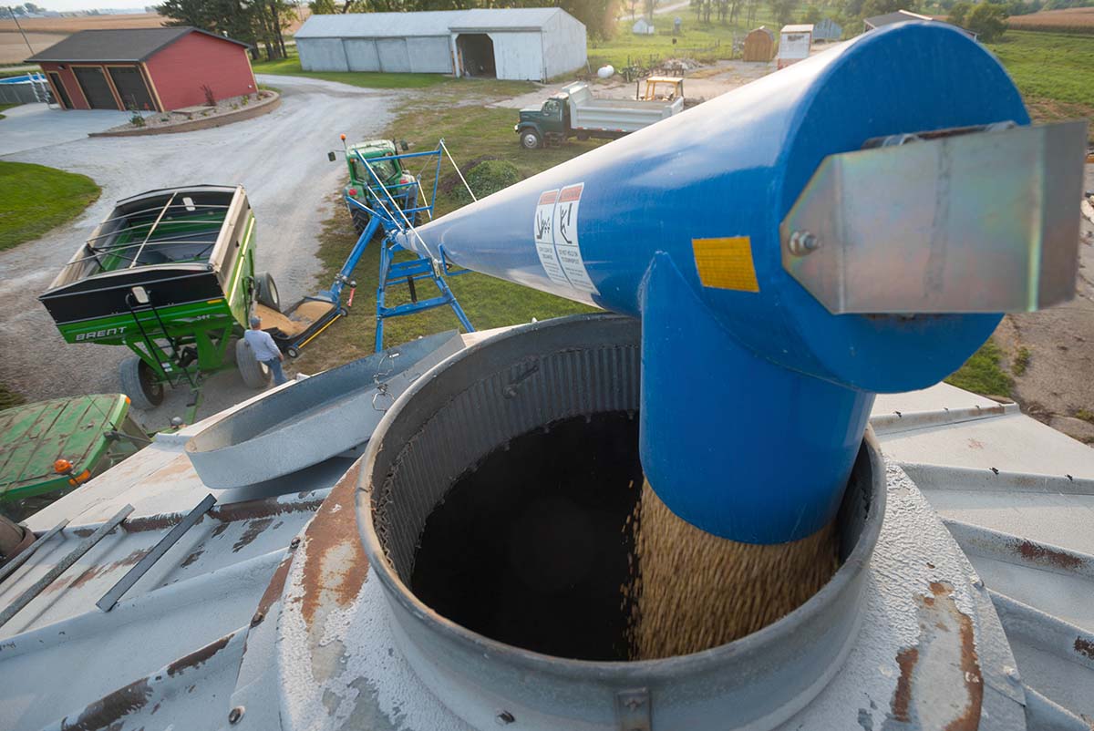 John Deere tractor attached to auger