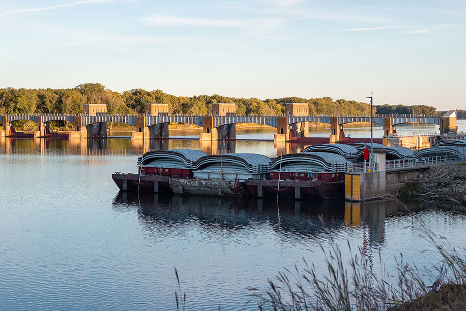 Barges on a river in Iowa hauling soybeans