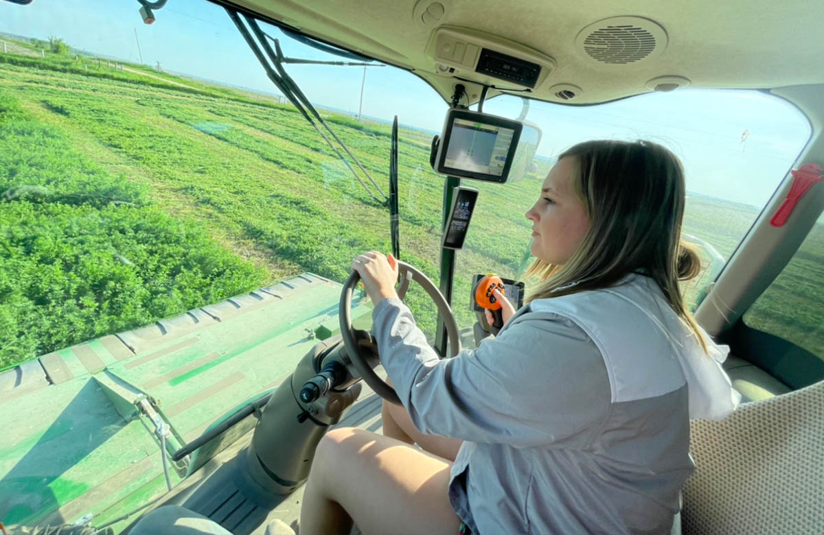 Advocate of agriculture driving farming equipment