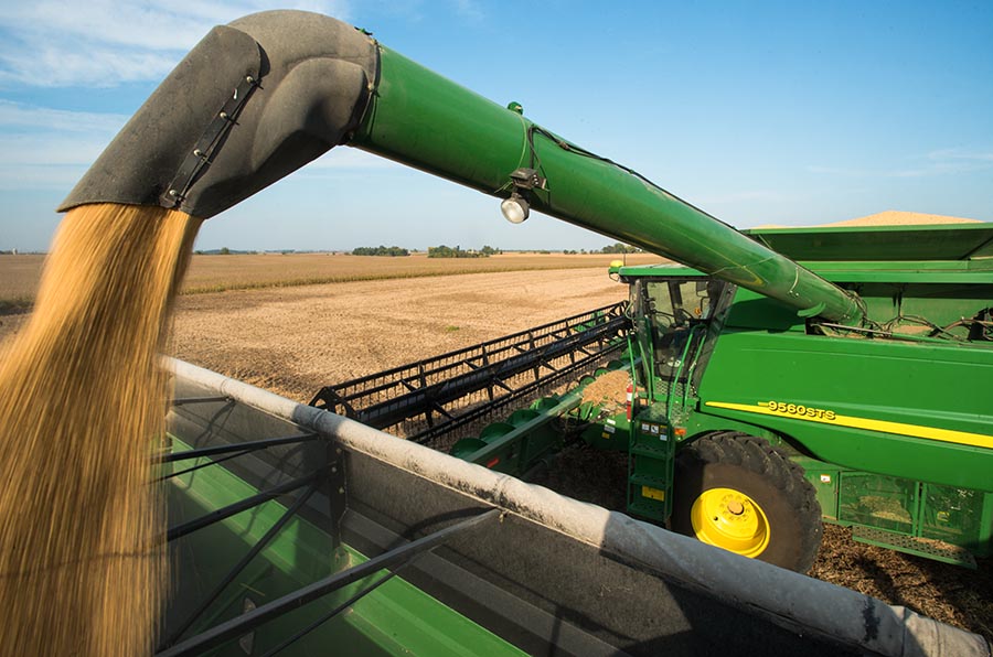 John Deere combine unloading soybeans