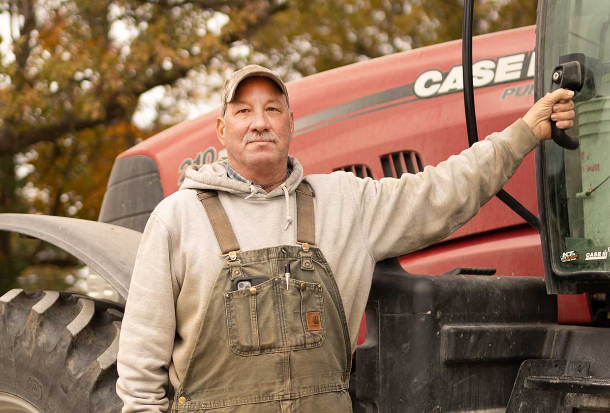 Iowa farmer standing next to Case IH tractor
