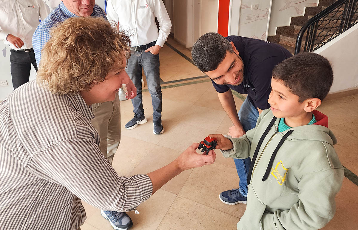 Sharing small tractor at Skretting in Egypt