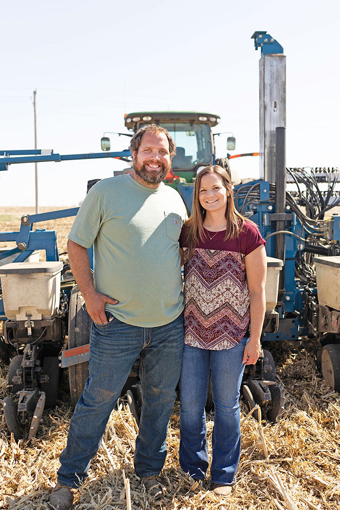 Farmers standing in field during planting season