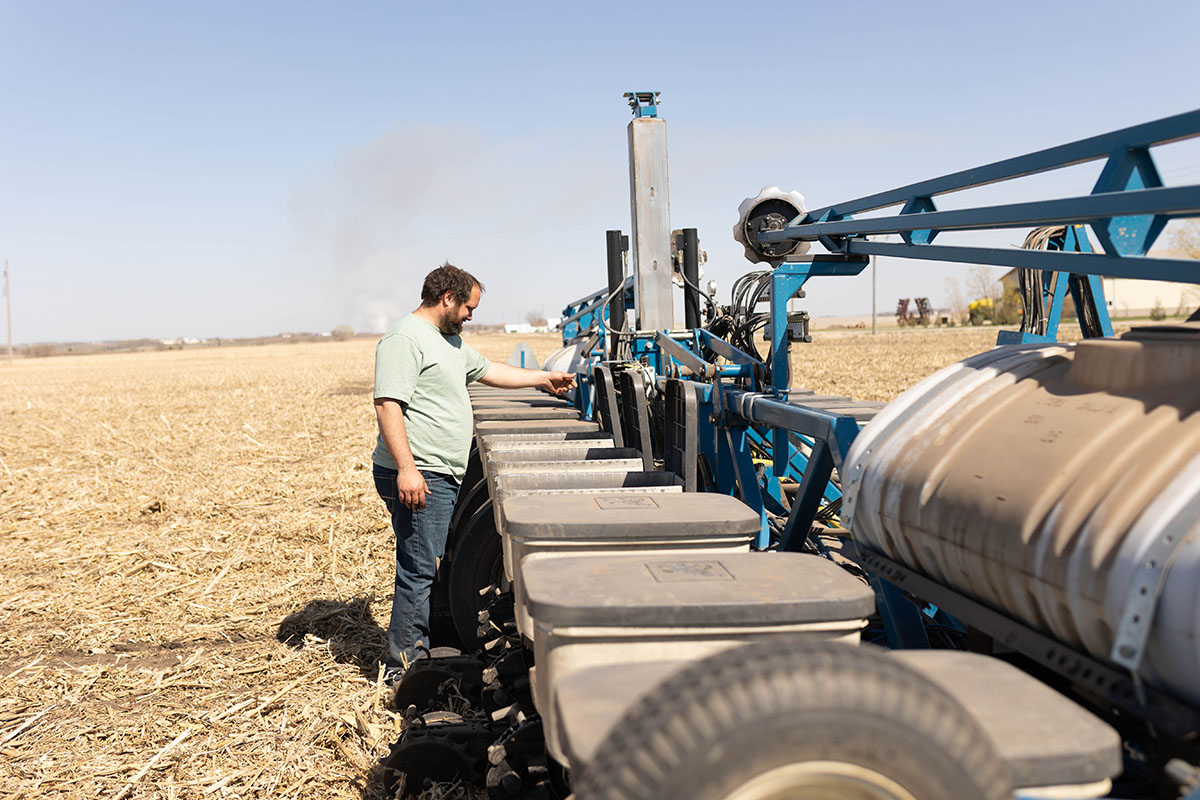 Farmer with planter in field