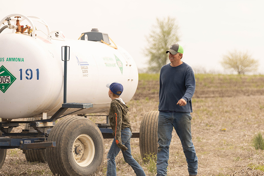 Father and son on farm with anhydrous ammonia