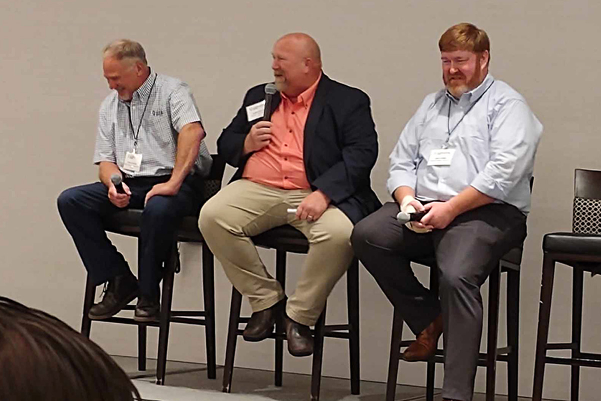 Farmers talking during panel discussion