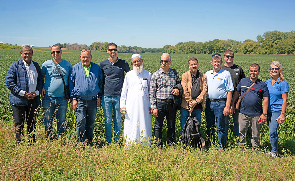 Trade team from the Maghreb in soybean field