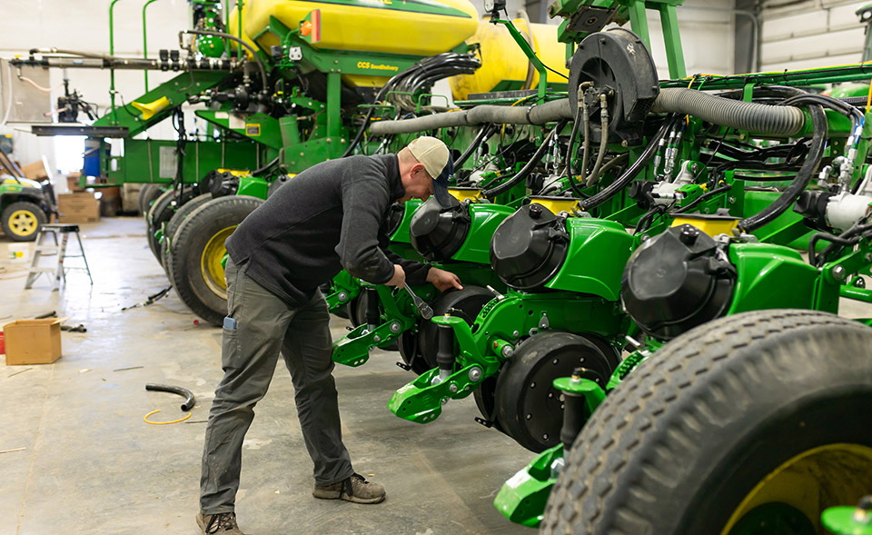 Farmer preparing planter for spring