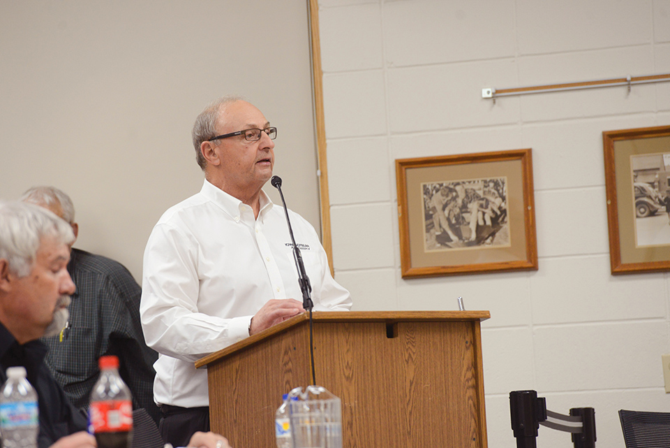 Farmer speaking at podium