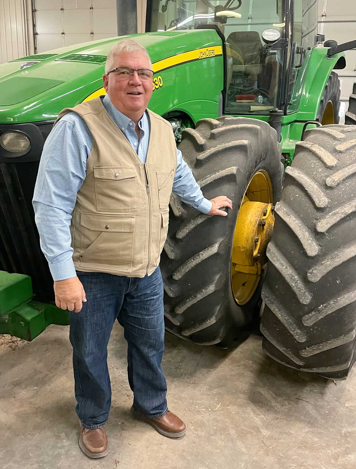 Senator Dan Zumbach Farmer standing near John Deere tractor