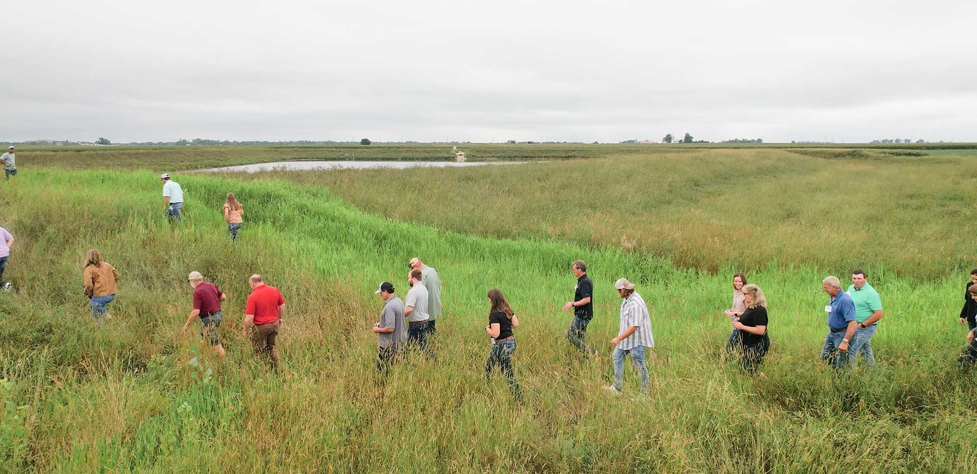 Experience Class Farmers walking in field