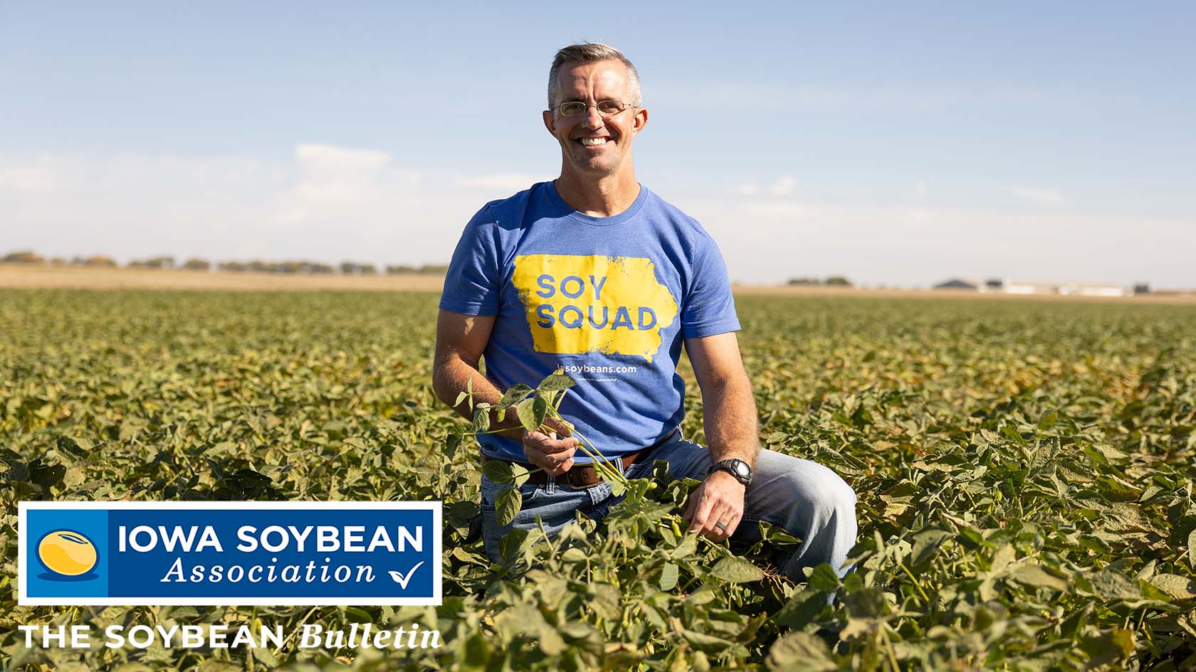 Farmer in soybean field