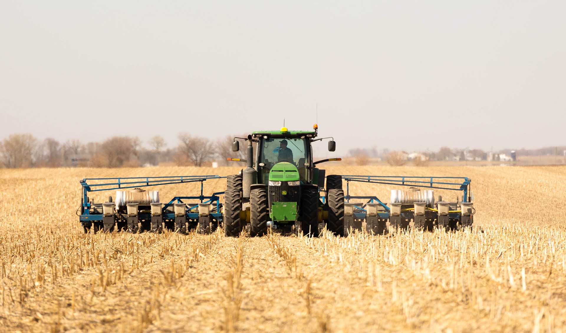 Tractor and planter in field