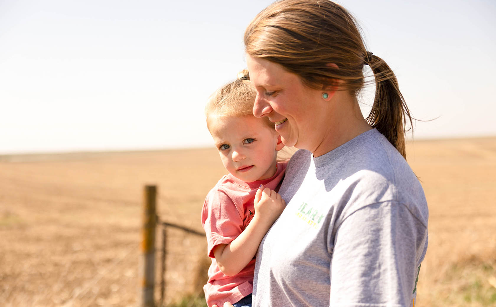Taylor Blair and Daughter Farmer and daughter in field
