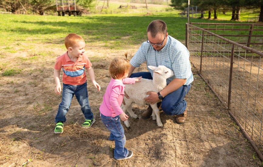 Farm kids with lamb