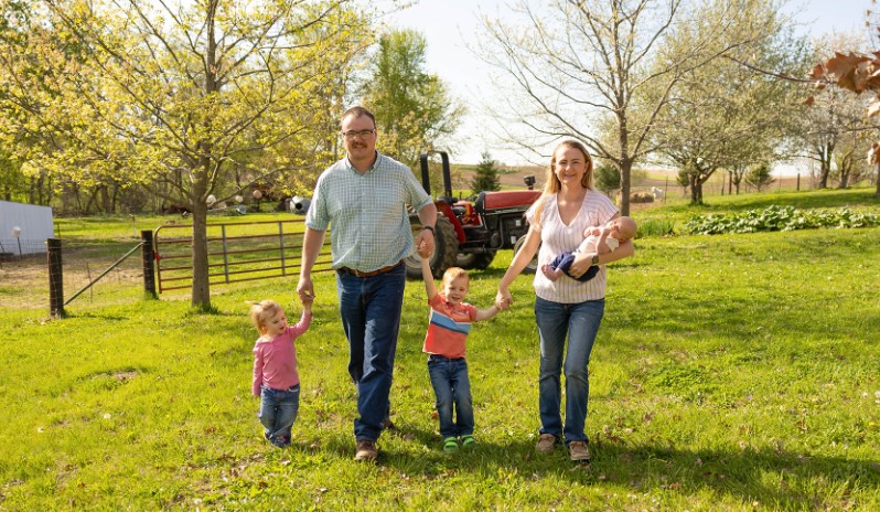 Jarret Horn and Family Farm family walking around farm