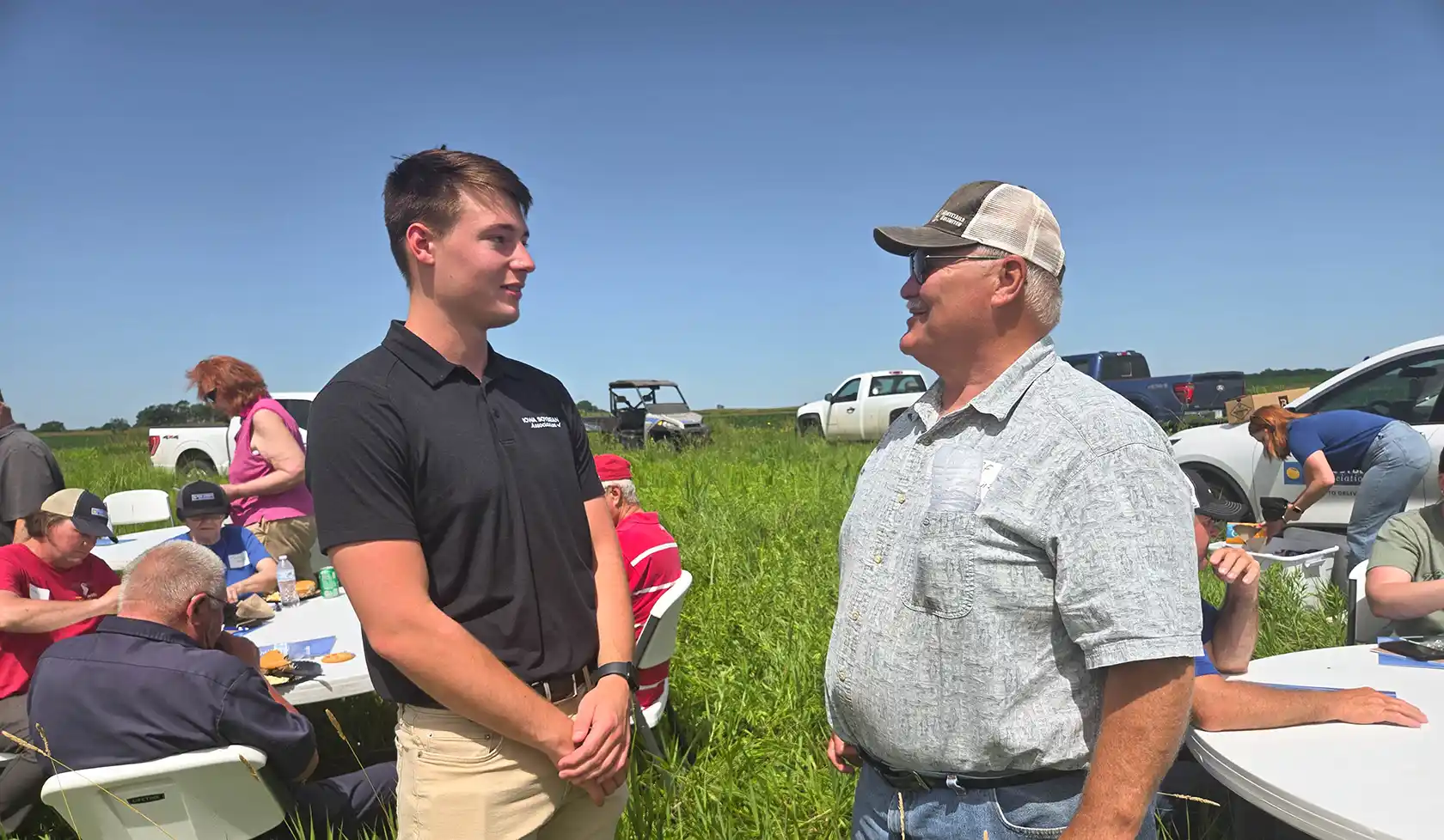 Farm to River Field Day Alex Buseman talking with farmer