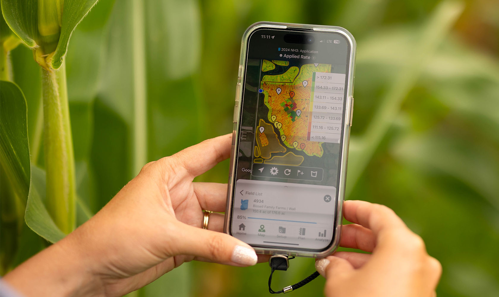 Farmer on phone using agriculture tool