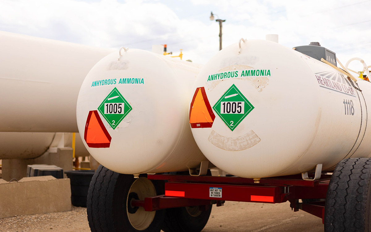 Two tanks with slow moving signs on them.