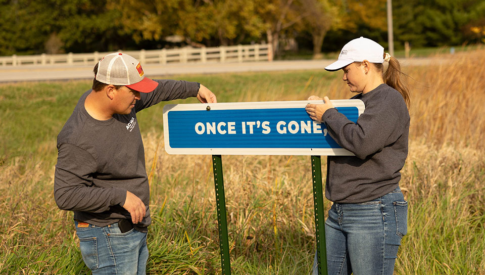 Conservation Signage Installation Burma Shave style signs being installed in Iowa