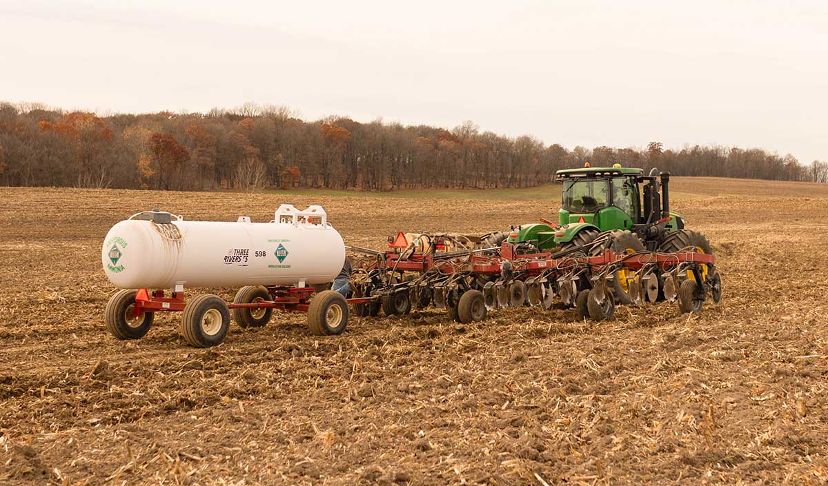 Wait For The Right Temperature Tractor applying anhydrous ammonia to field