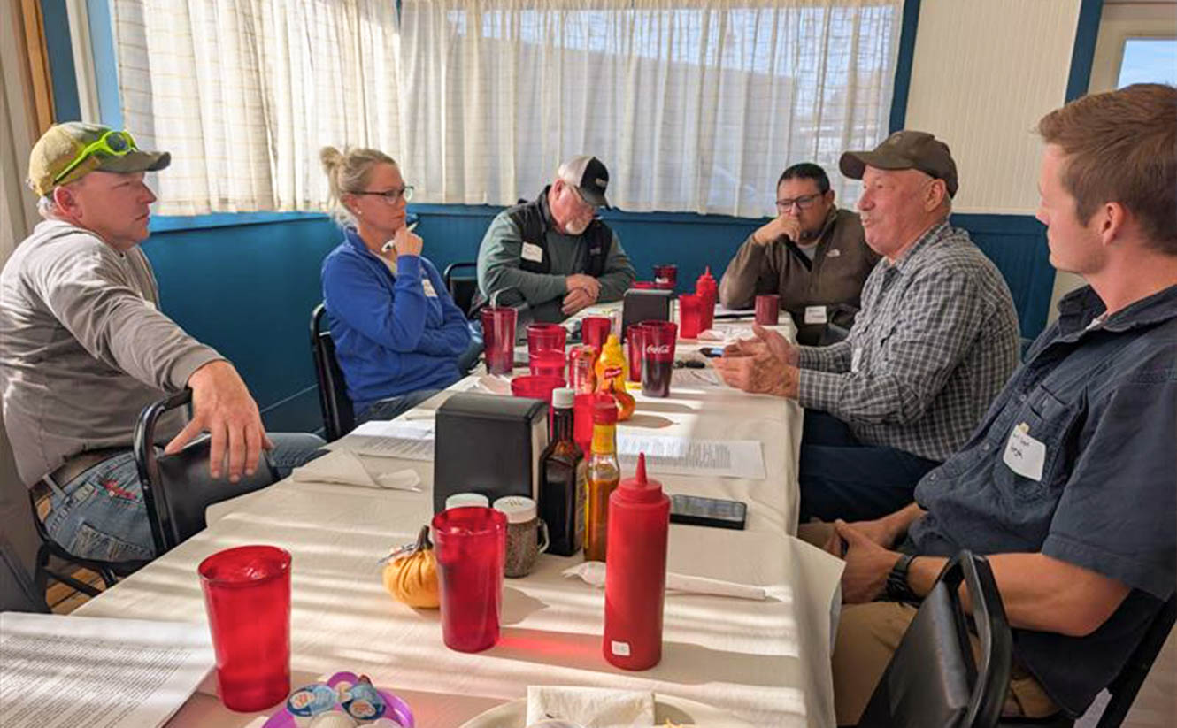 Farmers meeting and discussing future soybean policy pr