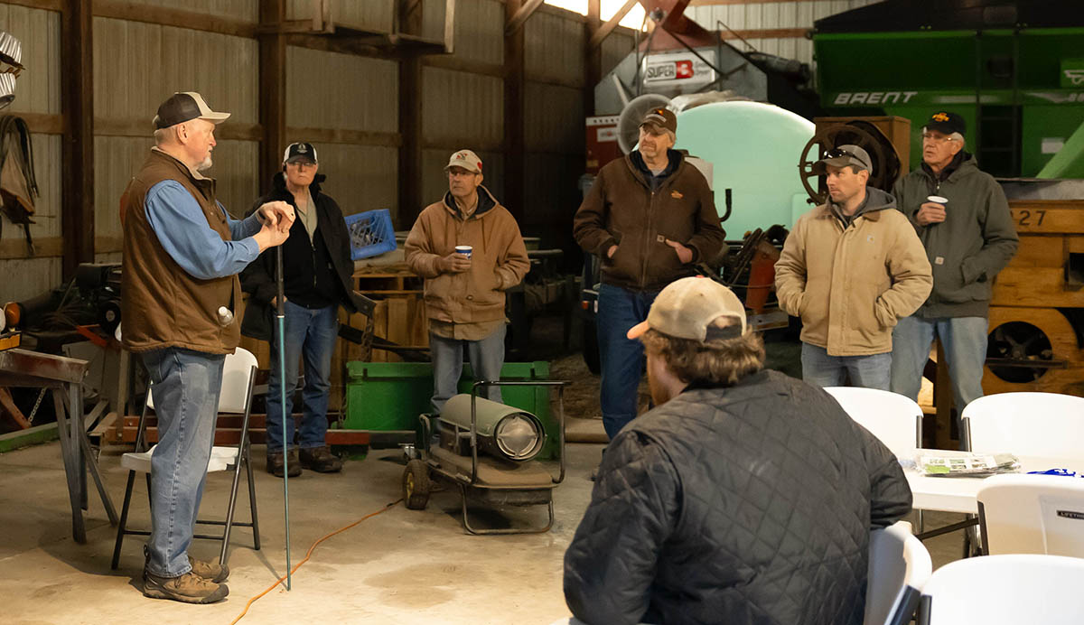 Jack Boyer speaking with farmers in his shop.