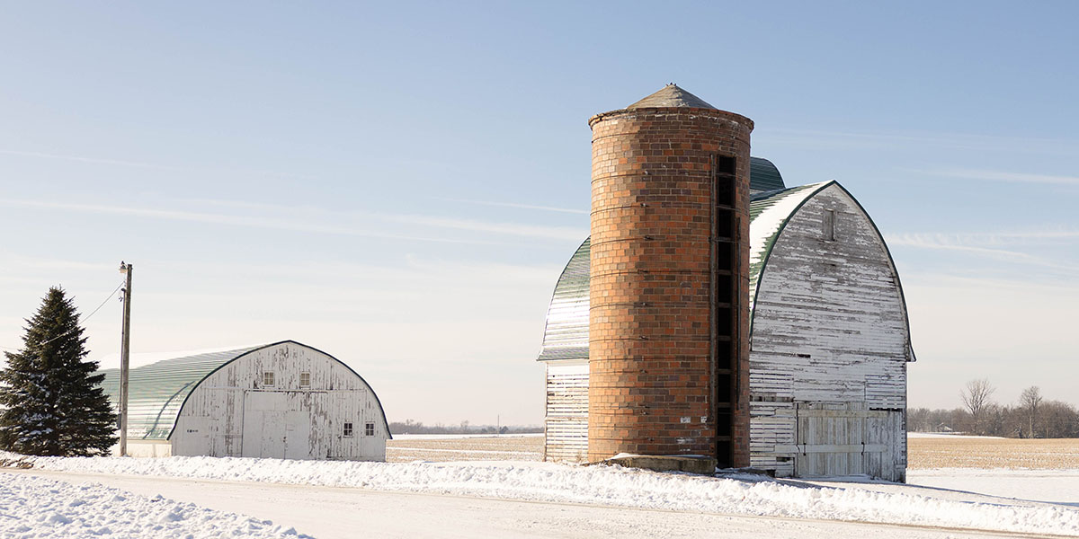 Iowa farm in winter Corn crib and shed in winter