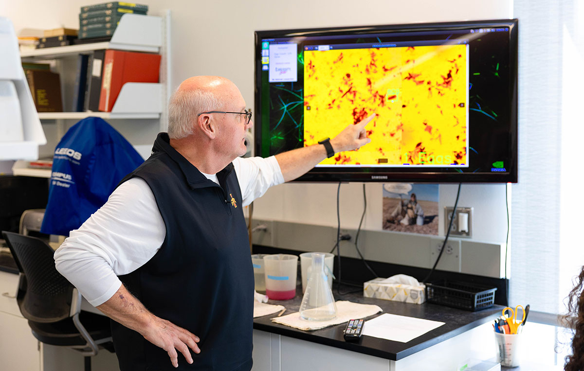 Looking at soil samples in research lab at Iowa State U
