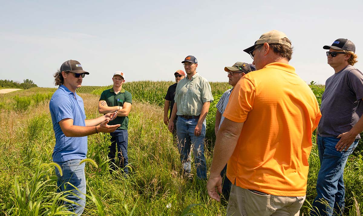Farmers talking with Brandon Iddings during Experience 