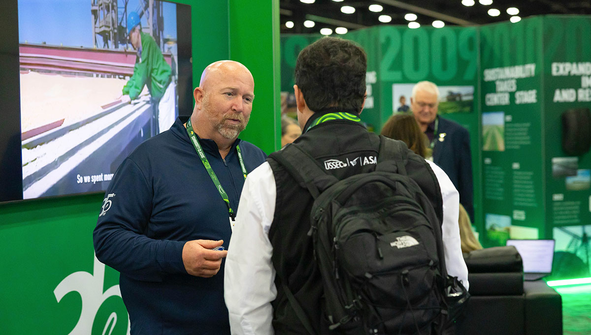 Iowa farmer having a conversation at Commodity Classic
