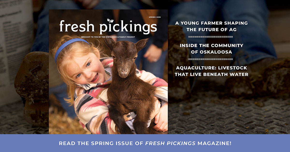 Girl holding goat on magazine cover