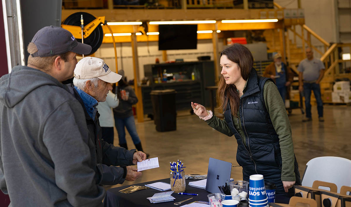 Checking in for Conservation in Action Producer Services Coordinator Emma Harper talking with farmers