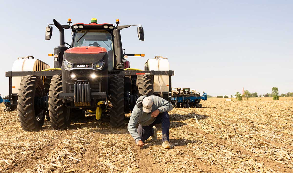 Iowa farmer outside of tractor during planting season