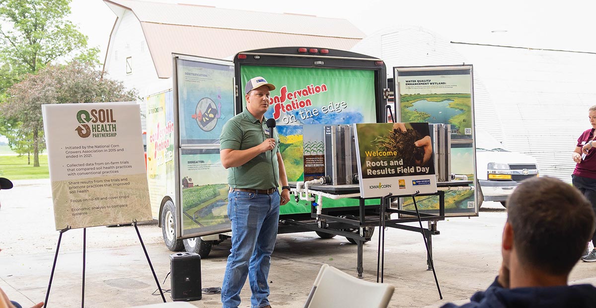 Brock Webb Research agronomist speaking at Roots and Results field day
