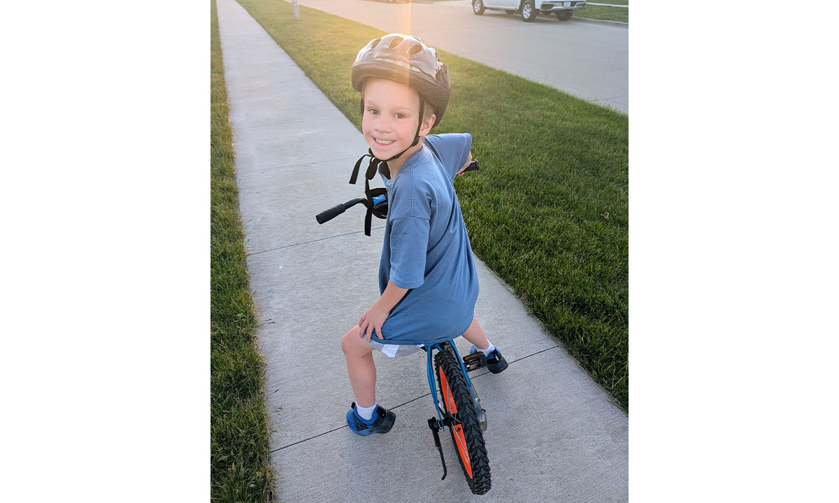 Luca on a bicycle Young boy riding bike
