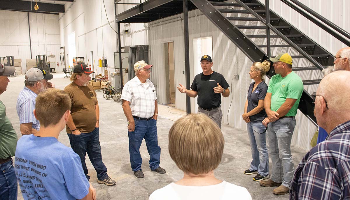 Excel Engineering Tour Doug Sobotka talking with farmers in Diagonal