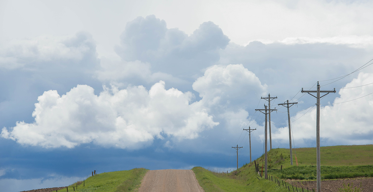 Stormy clouds coming in over farmland