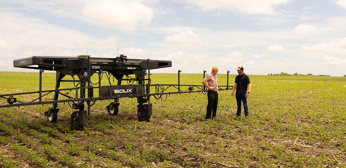 Talking next to an autonomous sprayer in a field