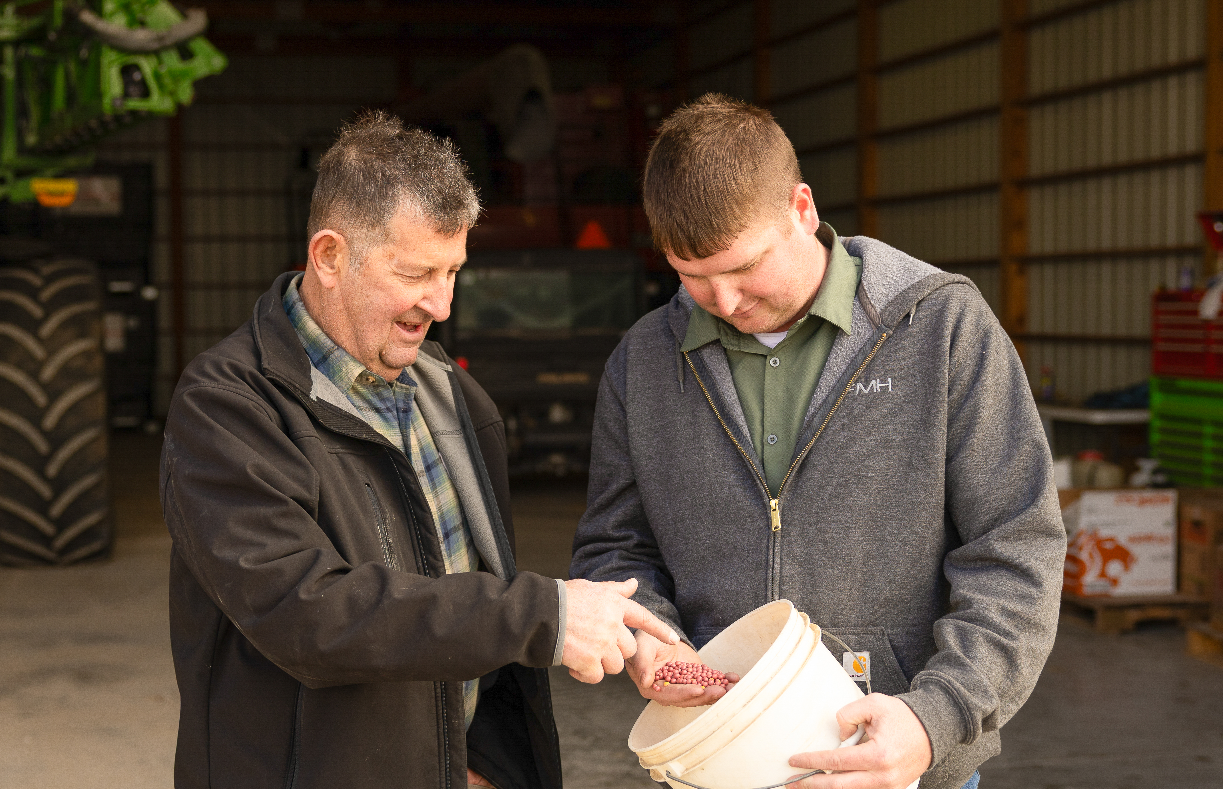 Roger Van Ersvelde and Cole Olson looking at Soybeans